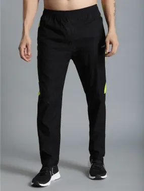 Harold Solid Regular fit Polyester Trackpants for Men with zipper pockets Comfortable Breathable Fabric Stretchable for Everyday Use Ideal for Yoga Training Gym Running or Performance